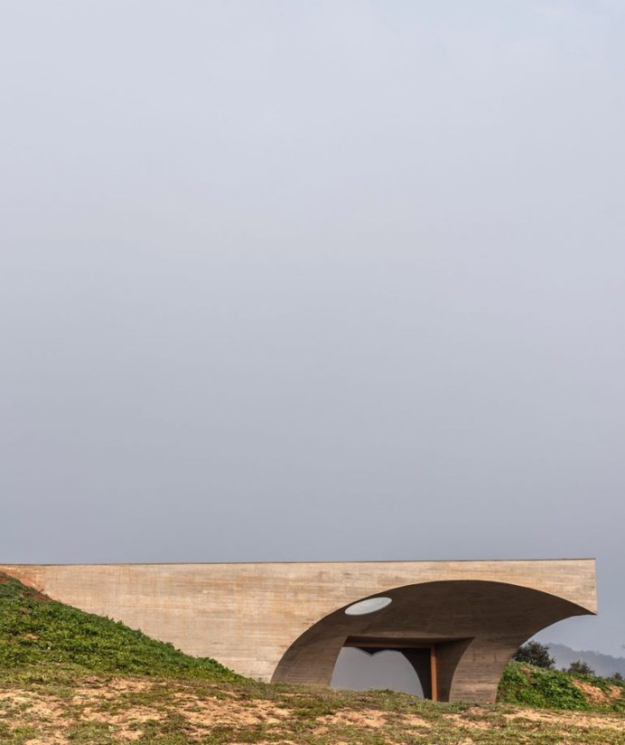 Aires Mateus tucks concrete house underneath hillside in Monsaraz