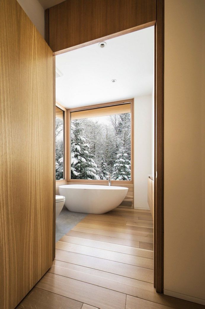 Wooden Wing Cottage in Quebec Perched on a Granite Bedrock 10