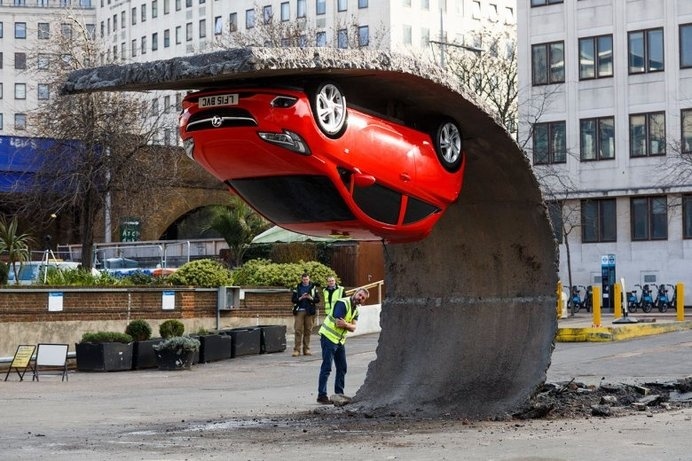 London Art Installation is an Upside Down Opel / Vauxhall Corsa Supermini #supermini #down #red #installation #london #art #corsa #open #vauxhall #upside