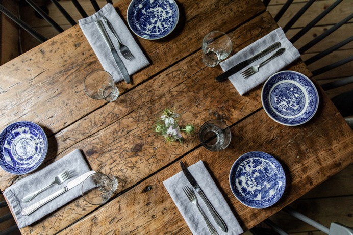 French sources the tableware from antiques stores around Maine; downstairs, in the pantry, there are stacks of blue-and-white china and jadeite bowls. French's mother, who works at the Lost Kitchen, sewed the restaurant's original cloth napkins.
