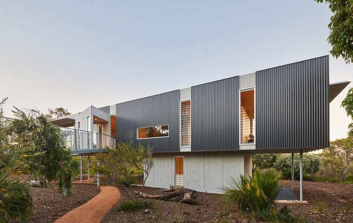 Wilderness House is a Elevated Platform with Large Areas of Glass