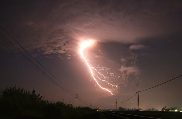In Indonesia, A Lightning Storm Illuminates An Erupting Volcano #clouds #volcanic #electricity #photography #storm #eruption #nature #volcano #lightning