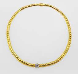 Diamond solitaire in a gold chain taken