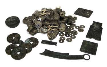 Group of ring coins, lid of jar, plaque from Bronze