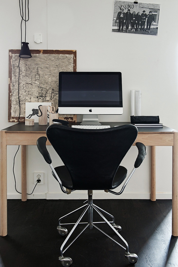 Black floors, grey walls and lots of art pieces