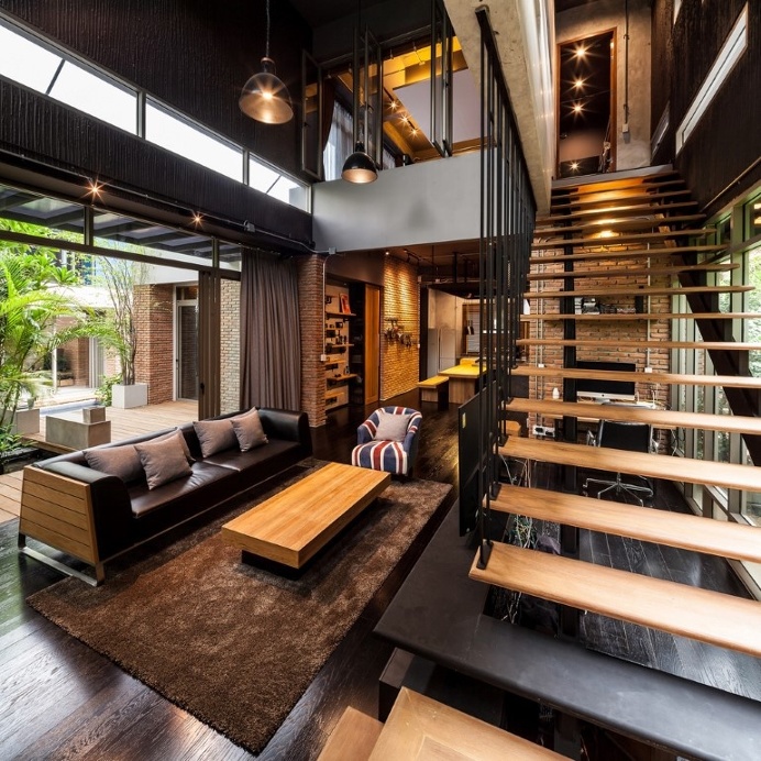 Two Houses Connected to Each Other for Two Brothers with Different Lifestyles